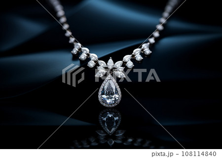Luxury jewelry, platinum necklace with diamonds on dark silk fabric close-up. Golden necklace in the store. Beautiful diamond pendant necklace. Jewelry showcase, selective focus 108114840