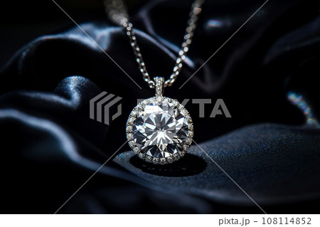 Luxury jewelry, platinum necklace with diamonds on dark silk fabric close-up. Golden necklace in the store. Beautiful diamond pendant necklace. Jewelry showcase, selective focus Luxury jewelry, platinum necklace with diamonds on dark silk fabric close-up. Golden necklace in the store. Beautiful diamond pendant necklace. Jewelry showcase, selective focus 108114852