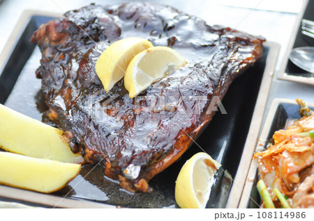 barbecue pork rib or grilled pork rib with potato and lemon barbecue pork rib or grilled pork rib with potato and lemon 108114986