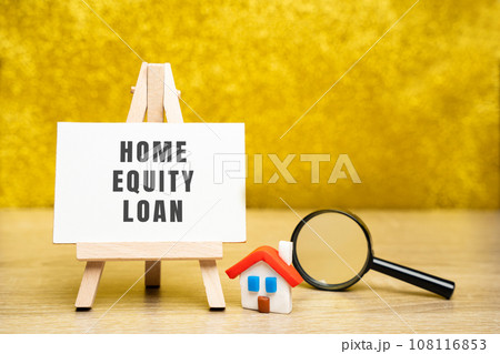Home equity loan concept. Type of loan in which the borrowers use the equity of their home as collateral. Easel, house and magnifying glass. Real estate and credit 108116853