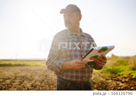 Farmer is checking soil quality before sowing. Agriculture, gardening or ecology concept. 108120790