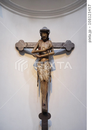 Schmerzensmannkreuz, Jesus on the cross, his arms crossed like a gesture of embrace, Neumunster Collegiate Church in Wurzburg, Germany 108123457