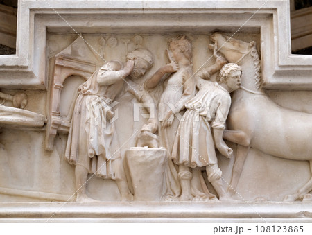 The miracle of Saint Eligius. Tabernacle bas-relief of a horseschoer made by Nanni di Banco and part of an external wall of Orsanmichele Church in Florence, Tuscany, Italy The miracle of Saint Eligius. Tabernacle bas-relief of a horseschoer made by Nanni di Banco and part of an external wall of Orsanmichele Church in Florence, Tuscany, Italy 108123885