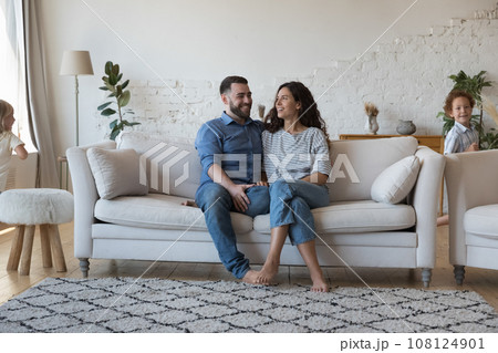 Couple of happy parents enjoying being at stylish home Couple of happy parents enjoying being at stylish home 108124901