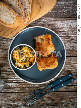 Pieces of fried cod fillet. Pieces of fried cod fillet. 108125743