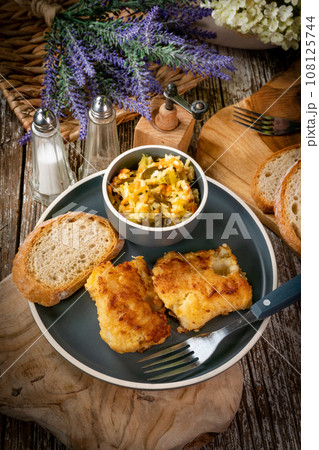 Pieces of fried cod fillet. Pieces of fried cod fillet. 108125744
