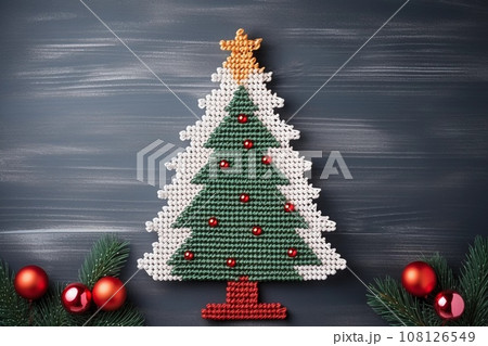 Handmade Christmas tree and Christmas balls on gray background. Winter holidays celebration. AI generated. 108126549