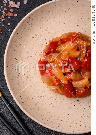 Delicious fresh salad with slices of grilled chicken, pineapple and sweet pepper 108128349