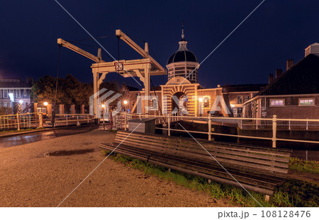 The old city gate Morspoort in Leiden at sunrise. The old city gate Morspoort in Leiden at sunrise. 108128476