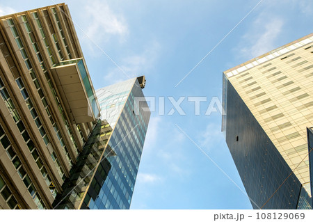 Perspective view of modern high-rise glass skyscraper building. 108129069