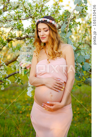 Beautiful pregnant woman relaxing in the park. Happy pregnant woman 108130436