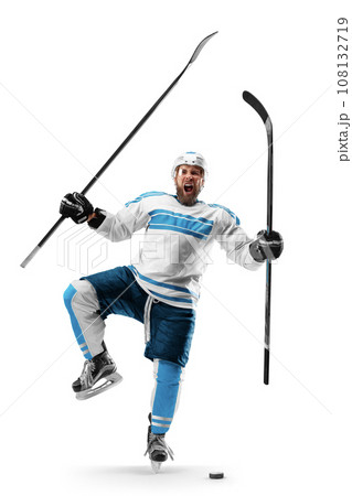 Very emotional hockey player with sticks in his hands. Sports emotions. Athlete in action. Hockey athlete with desire to win and be champion 108132719