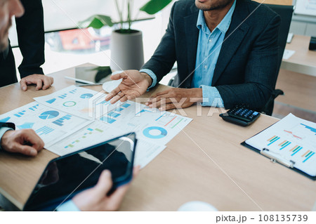 Asian business advisor meeting to analyze and discuss the situation on the financial report in the meeting room.Investment Consultant, Financial , teamwork ,brainstorming ,startup and accounting. 108135739