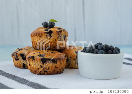 Homemade baked blueberry muffins with fresh blackberries. Tasty pastry sweet cupcake dessert. Berry pie cupcakes with organic berries. Gluten free healthcare recipe from alternative flour  108136396