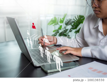 Businesswoman using computer to manage human...の写真素材 [108136550] - PIXTA