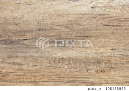 The background and texture of an aged board with cracks and expressive grains. 108138946