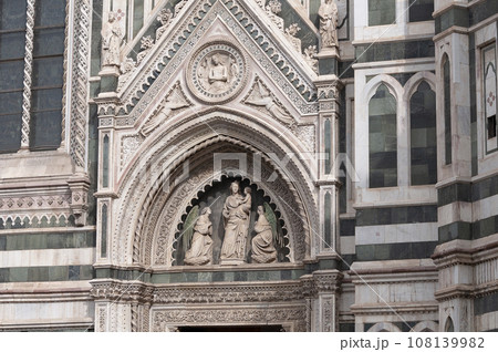 Details of the exterior of the di Santa Maria del Fiore or Cathedral of Saint Mary of the Flower - the main church of Florence, Tuscany, Italy. 108139982
