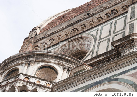 Details of the exterior of the di Santa Maria del Fiore or Cathedral of Saint Mary of the Flower - the main church of Florence, Tuscany, Italy. Details of the exterior of the di Santa Maria del Fiore or Cathedral of Saint Mary of the Flower - the main church of Florence, Tuscany, Italy. 108139988