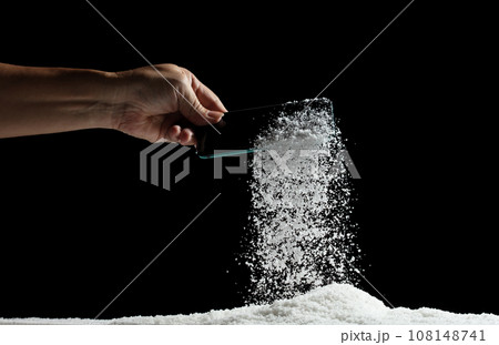Smart mobile phone fall under beneath snow ice winter. Lost mobile phone with blank screen on winter snow on the road. Snow fall from phone, hand pick up. Black background isolated Smart mobile phone fall under beneath snow ice winter. Lost mobile phone with blank screen on winter snow on the road. Snow fall from phone, hand pick up. Black background isolated 108148741