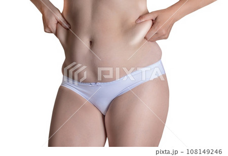 Woman measuring her belly fat with her hands, close up png invisible or white background Woman measuring her belly fat with her hands, close up png invisible or white background 108149246