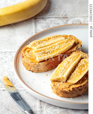 Tasty toast for breakfast with peanut butter banana. Close up food photo Tasty toast for breakfast with peanut butter banana. Close up food photo 108149335