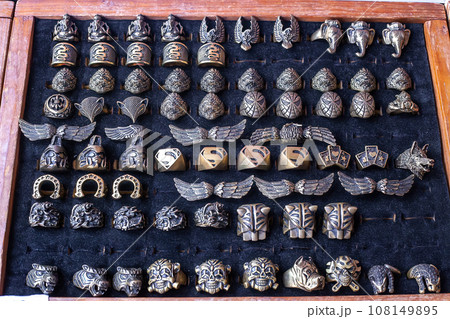 Mens Metal funny rings selling on street market in Phuket, Thailand 108149895