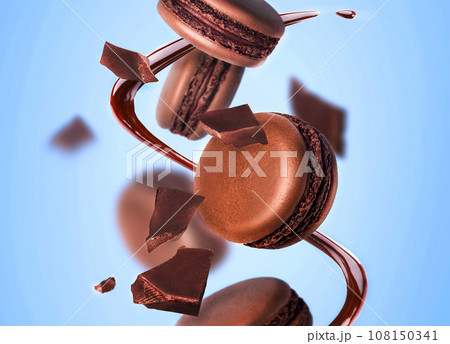 Macarons sweet chocolate macaron French are flying on a blue background closeup 108150341