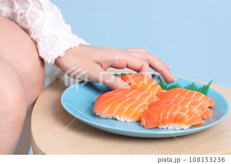 Hand with Sushi 108153236