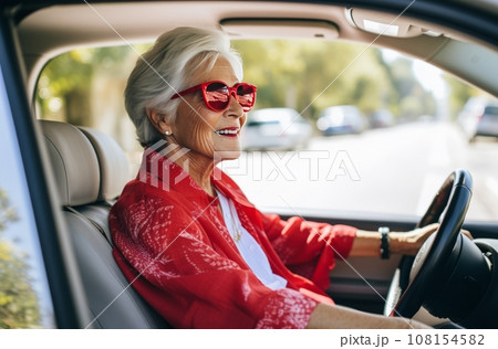70 year old Italian woman driving car 70 year old Italian woman driving car 108154582