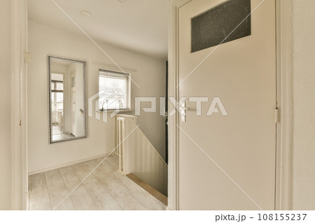 an empty room with white walls and wood flooring on the left side of the room, there is a chalk board that says an empty room with white walls and wood flooring on the left side of the room, there is a chalk board that says 108155237