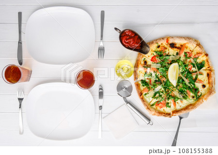 Freshly cooked pizza for two people 108155388
