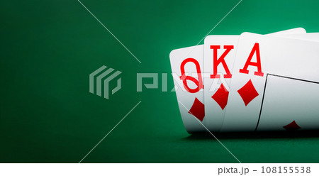 playing cards on a green table 108155538