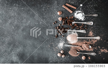 Sweet spices on a black table Sweet spices on a black table 108155903