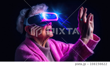 Old granny in VR glasses at virtual reality manages with gestures. pink and blue colors combination 108156622