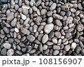 Round gray gravel pattern. Abstract background texture. Top view. Background from sea gray stones 108156907