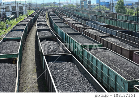 Trains of railway wagons full of coal 108157351