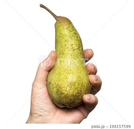 a pear held in one hand 108157599