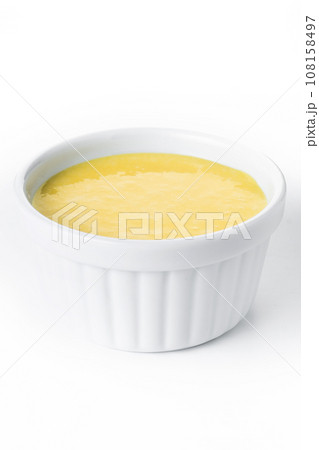 Homemade vanilla custard isolated on white background. Homemade vanilla custard isolated on white background. 108158497