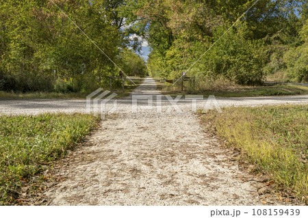 Katy Trail is crossing a local dirt road near Hartsburg, Missouri, fall scenery Katy Trail is crossing a local dirt road near Hartsburg, Missouri, fall scenery 108159439