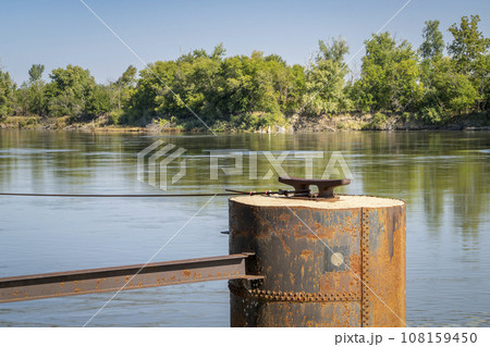 rusty mooring pile with a cleat for barges on the Missouri River at Brownville, Nebraska rusty mooring pile with a cleat for barges on the Missouri River at Brownville, Nebraska 108159450