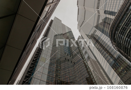 Looking up to highrise office build containing architecture modern design. 108160876