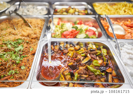 Various hot dishes . Glass Showcase in a buffet or self-service restaurant. 108161715