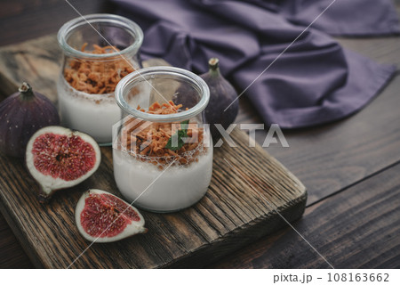 Dessert panna cotta with caramel cheese and fresh figs 108163662