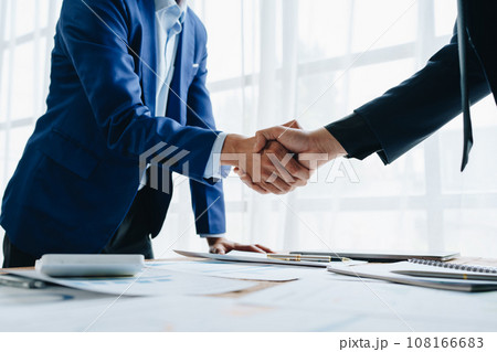 Young businesswoman and businessman collaborate with partners to increase their business investment network for Plans to improve quality next month in their office. agreement concept 108166683