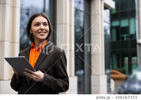 Elegant young manager with a tablet in the office area 108167355