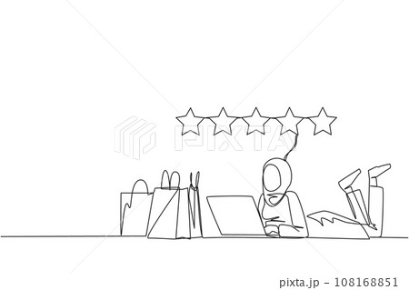 Single continuous line drawing young Arabian woman on stomach while typing on laptop. Next to the laptop is a shopping bag. Give the best review with pleasure. One line design vector illustration 108168851