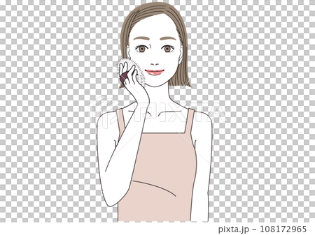 A woman applying face powder on her face with a puff A woman applying face powder on her face with a puff 108172965