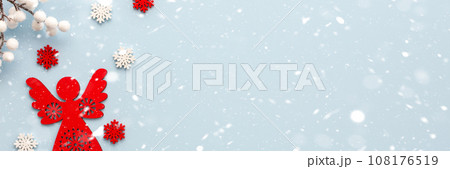 Christmas angel with white and red snowflakes 108176519