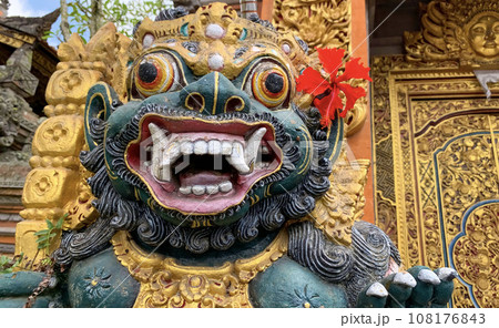 Traditional old ancient Balinese statue of demon angel called barong bali guarding sacred ritual temple Traditional old ancient Balinese statue of demon angel called barong bali guarding sacred ritual temple 108176843