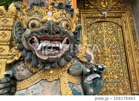 Traditional old ancient Balinese statue of demon angel called barong bali guarding sacred ritual temple Traditional old ancient Balinese statue of demon angel called barong bali guarding sacred ritual temple 108176865